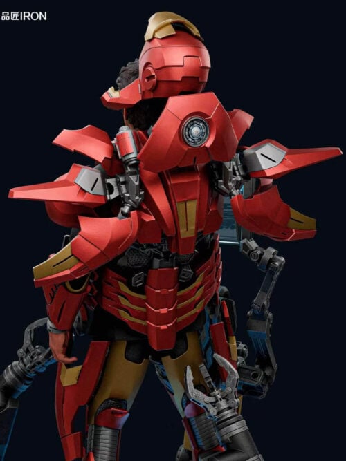 Rear upper-body close-up of the IRON Studio Iron Man MQ70 Mark VII statue displaying the splayed red-and-gold back flaps, central circular rear detail, mechanical hinges, and open helmet above Tony Stark's head.