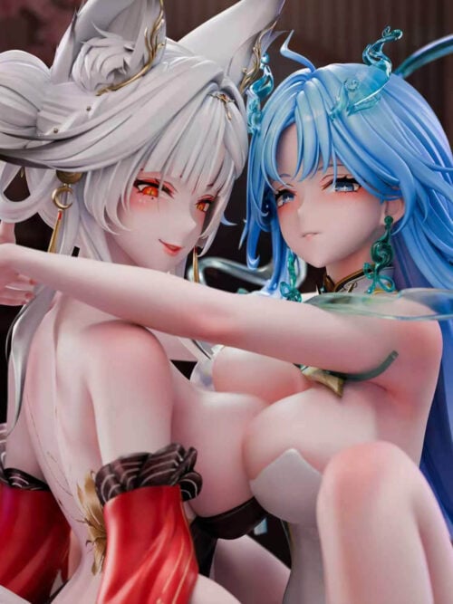 Close-up render of both faces. The white-haired figure has fox ears, red eyes, and gold hair ornaments, while the blue-haired figure has blue eyes, translucent blue hair pieces, and a green earring; an arm crosses the foreground.