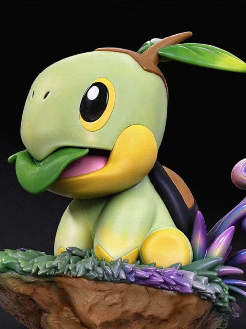 Low-angle close-up render of the miumiu Studio Turtwig figure showing the folded green leaf in its open mouth, yellow lower jaw, and textured grassy rock base.