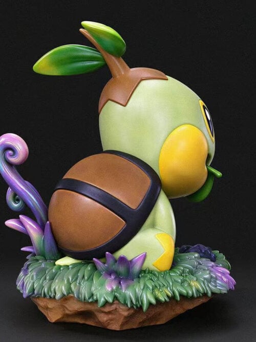 Rear three-quarter studio render of the miumiu Studio Turtwig figure highlighting its segmented brown shell, two-leaf head sprout, and grassy base with purple-and-blue tendrils.