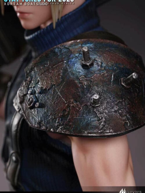 Extreme close-up of the heavily weathered left shoulder pauldron with rust texture and protruding bolts on the Cloud Strife statue