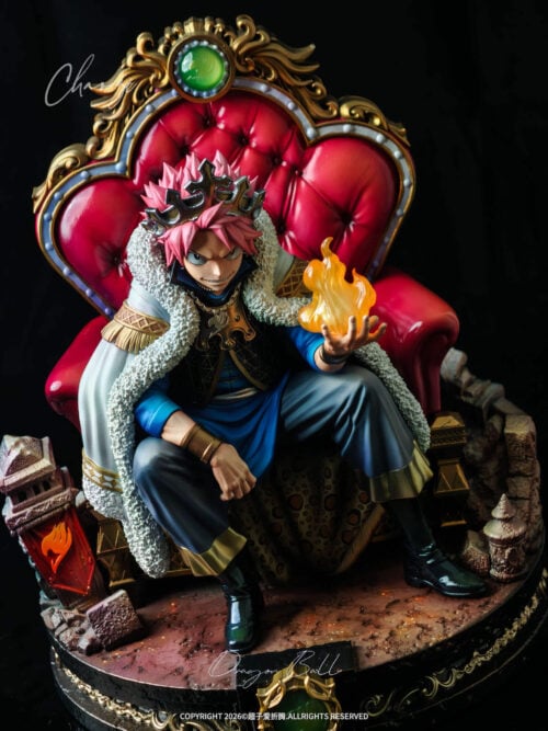 Natsu Dragneel from Fairy Tail seated on a red tufted throne holding an orange flame on a ruin base