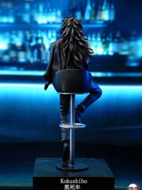 Full-body rear view of the Kokushibo Demon Slayer Suit Series statue seated on a bar stool atop a black square base, highlighting his long spiky hair and the black jacket draped over his left shoulder.