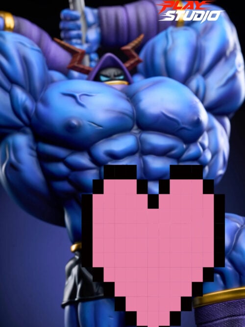 Close-up of the statue’s sculpted blue chest and small purple hood, showing brown lightning-shaped horns and light-blue eyes. A large pink pixelated heart covers the lower center of the picture.