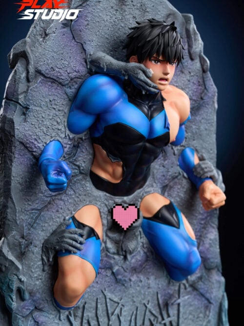 Three-quarter view of the statue set in a vertical stone slab, with a stone hand across the cheek, mouth open, and torn blue-and-black clothing. Fists and stone hands emerge from the rock, and a pink pixel heart covers the pelvis.
