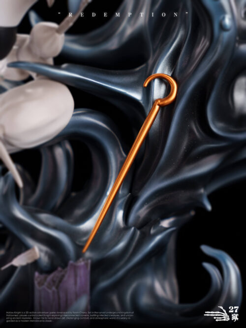 Close-up detail of Lace's hooked golden pin resting against the dark sculpted tendrils of the Redemption statue base.