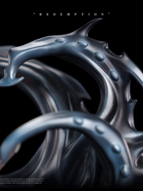 Close-up detail of the upper dark metallic-blue curving tendrils with raised bumps framing the top of the Redemption statue.