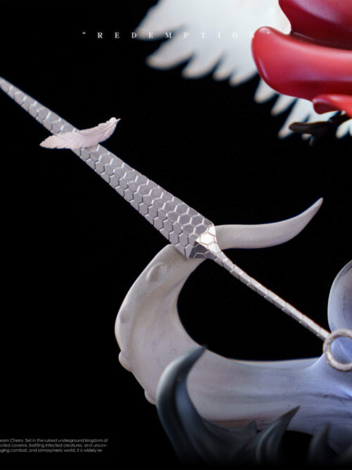 Close-up detail of Hornet's silver needle featuring a hexagonal geometric pattern and a small white feather resting on the blade.