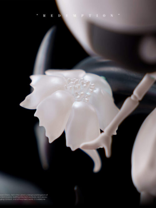 Macro close-up of the sculpted white flower with translucent-Looking petals held near Lace's hand on the Redemption statue.