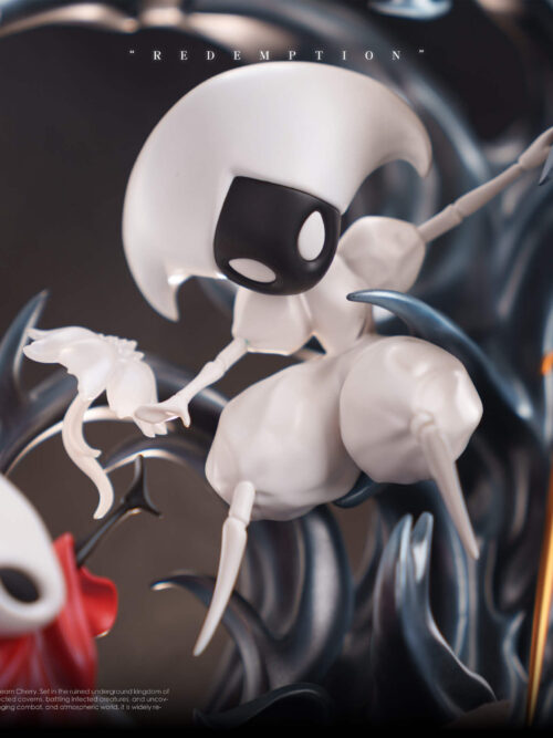 Close-up of Lace from the Redemption statue posed among dark blue-black tendrils with a white flower near her right hand and her golden hooked pin beside her.