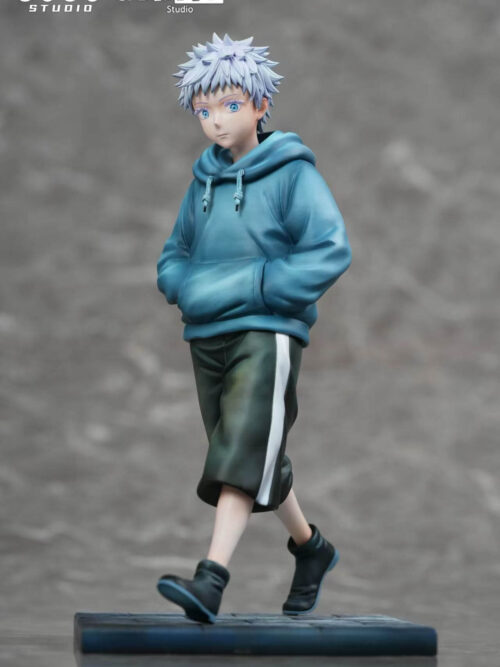 Young Satoru Gojo 1/6 figure by GUGU Studio and MIMO Studio in a blue hoodie and dark knee-length shorts with a white side stripe mid-stride on a rectangular base against a grey background.