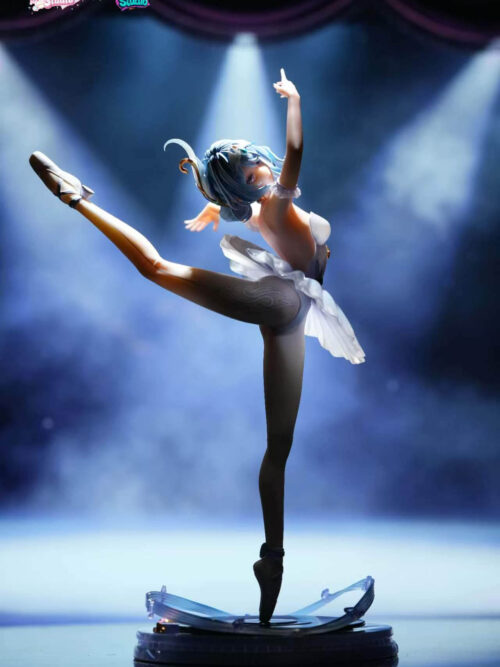 Full-body side view of the Odette Spessiva figure under dramatic overhead spotlighting that illuminates her face, blue hair, and translucent tutu on the circular stage base.