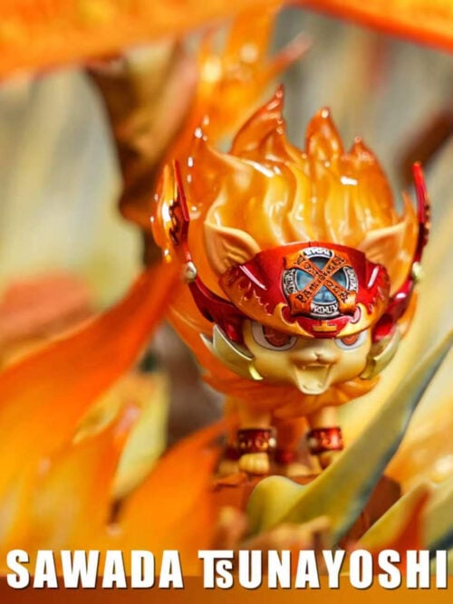 Close-up of Natsu the lion cub figure wearing red Vongola headgear among translucent orange flames on the Tsunayoshi Sawada statue base.