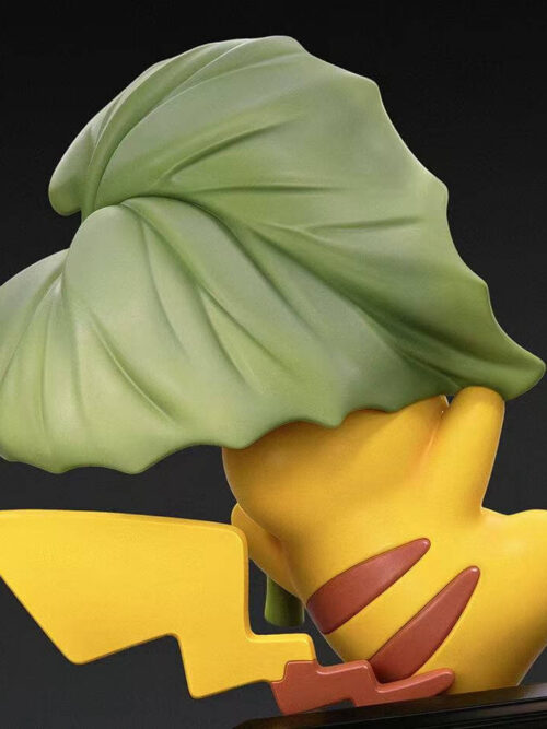 Back render of the Pikachu 30th Anniversary Vol. 12 figure showing the textured top of the green leaf, brown back stripes, and zigzag tail.