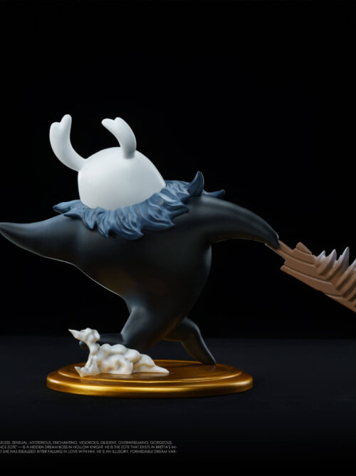 Rear view of the 27abyss Studio Zote the Mighty Grey Prince figure from Hollow Knight on a round gold base with a serrated brown blade and white dust effect.