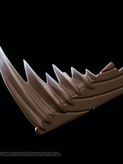Close-up detail of the serrated brown blade with white-tipped jagged teeth held by the 27abyss Studio Zote the Mighty Grey Prince figure.