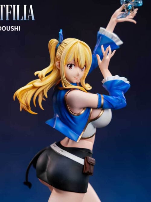 Horizontal view of the Lucy Heartfilia figure showing her side profile, backward glance, blue jacket with white cuffs, and raised hand holding a key